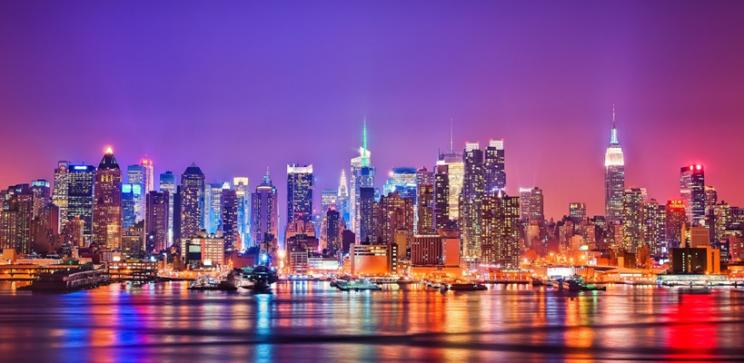 Brooklyn Bridge at sunrise with Lower Manhattan skyline in background