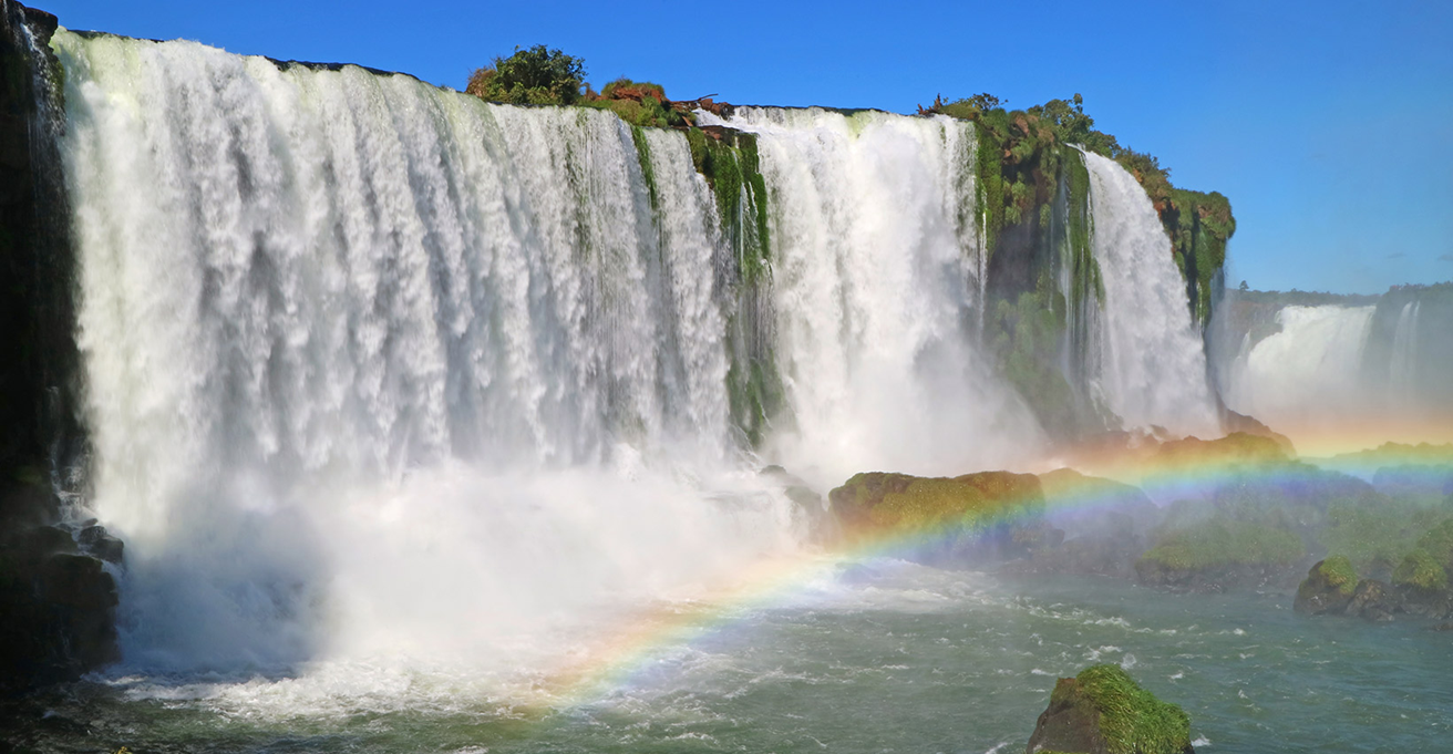Iguaçu Falls with mist rising between Brazil and Argentina